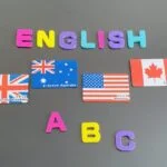 英語の文字とイギリス、オーストラリア、アメリカ、カナダの国旗。学習用素材。
